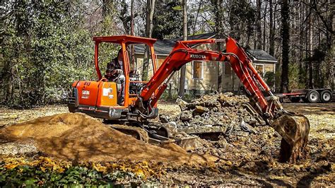 mini excavator spreading gravel|Spreading gravel with the mini Excavator .